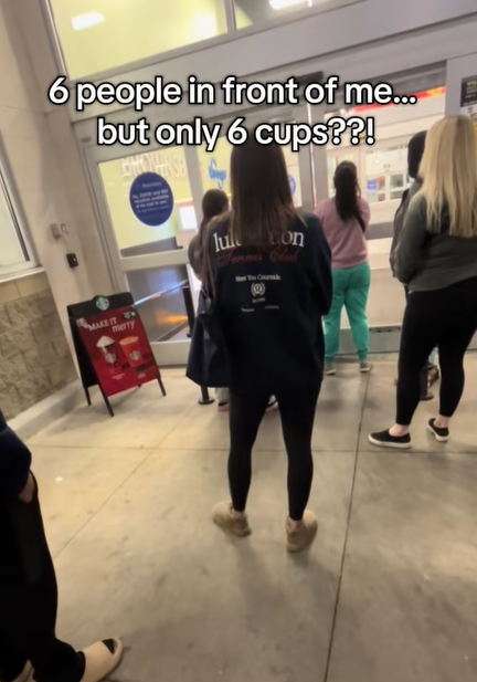 People waiting in line for shop to open